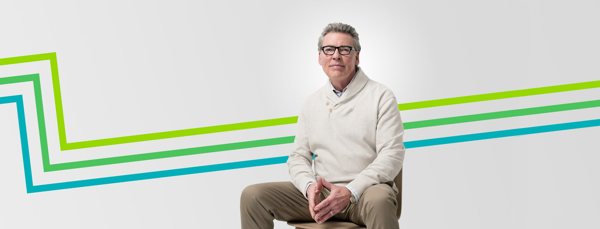 Sitting retired man wearing glasses featured in an article about checklist before retiring